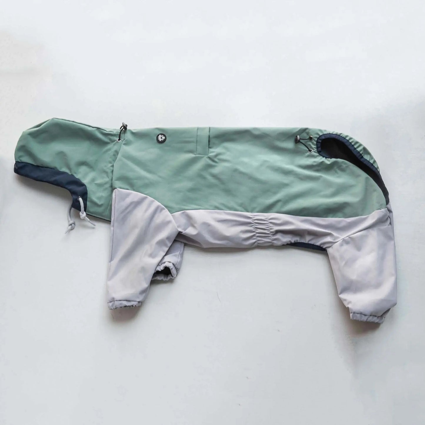 Side view of dog  raincoat, highlighting fit, coverage, and waterproof outdoor protection.