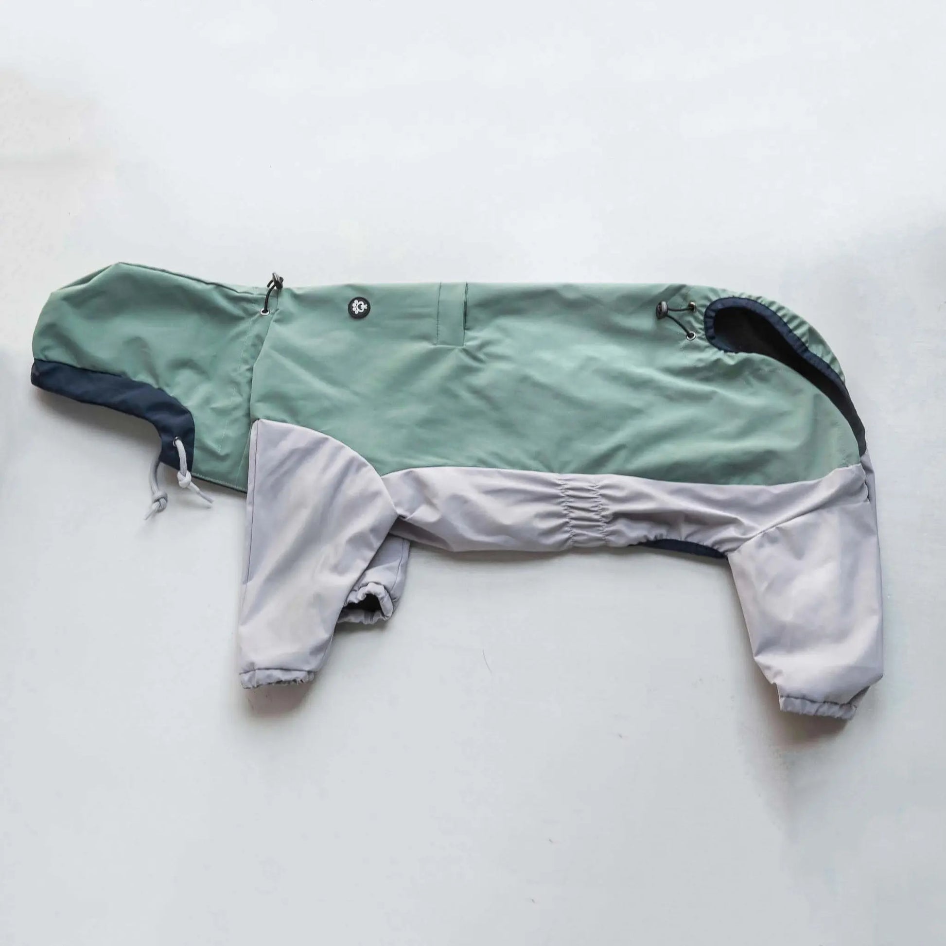 Side view of dog  raincoat, highlighting fit, coverage, and waterproof outdoor protection.