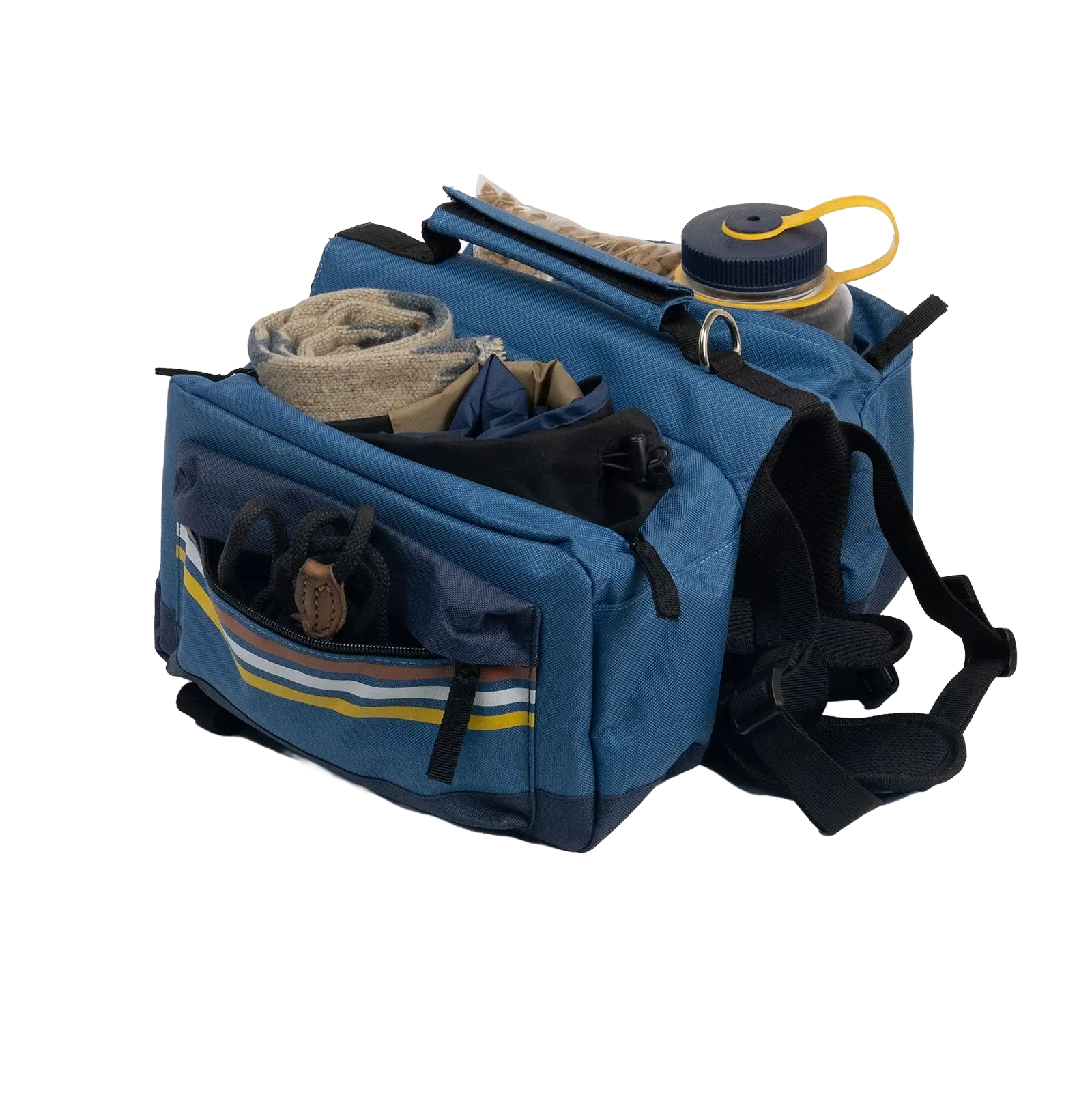 Spacious dog backpack packed with hiking essentials, highlighting its large storage capacity for outdoor gear.